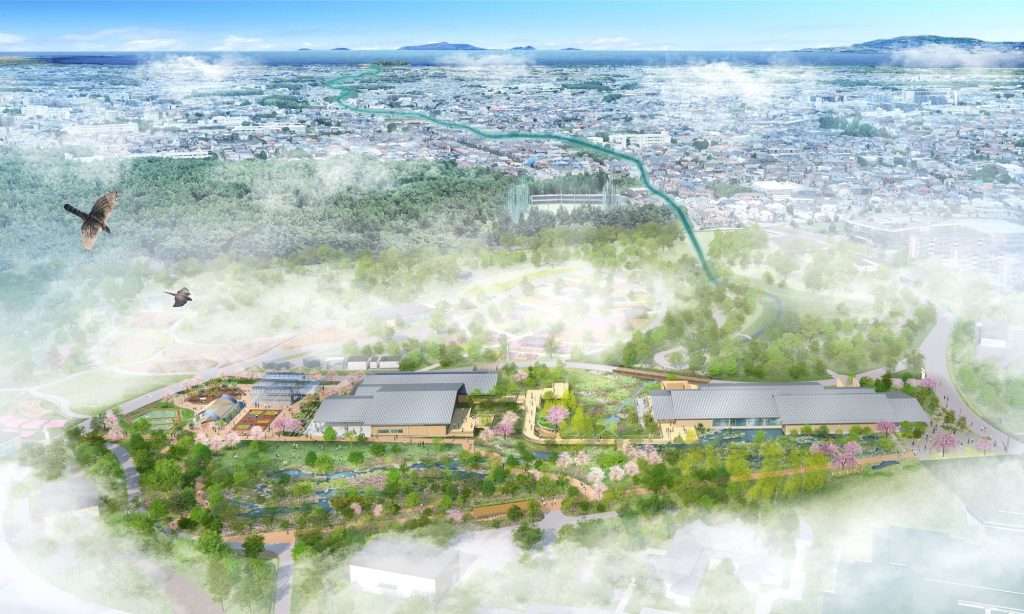 日本政府苑を上空から見た鳥瞰図。手前に瓦屋根の展示施設と池のある庭園が広がり、その奥に博覧会場の花壇エリア、遠景に市街地と海が見える